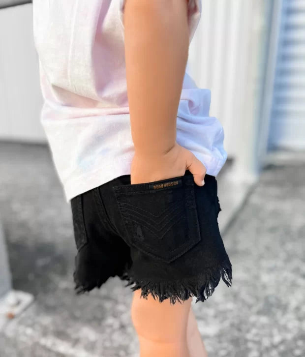 Girl shops black jean shorts